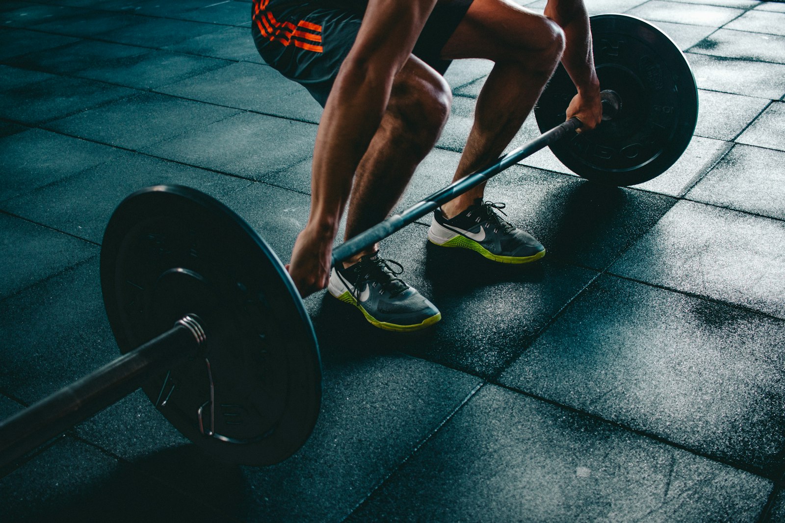Person training with weights in a gym, representing an active fitness lifestyle